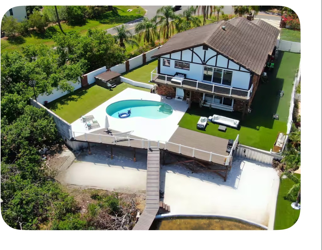 Luxury living room and waterfront view at St Pete Waterfront Mansion